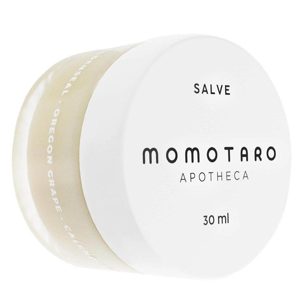 Momotaro Apotheca salve jar with visible brand name on a white background