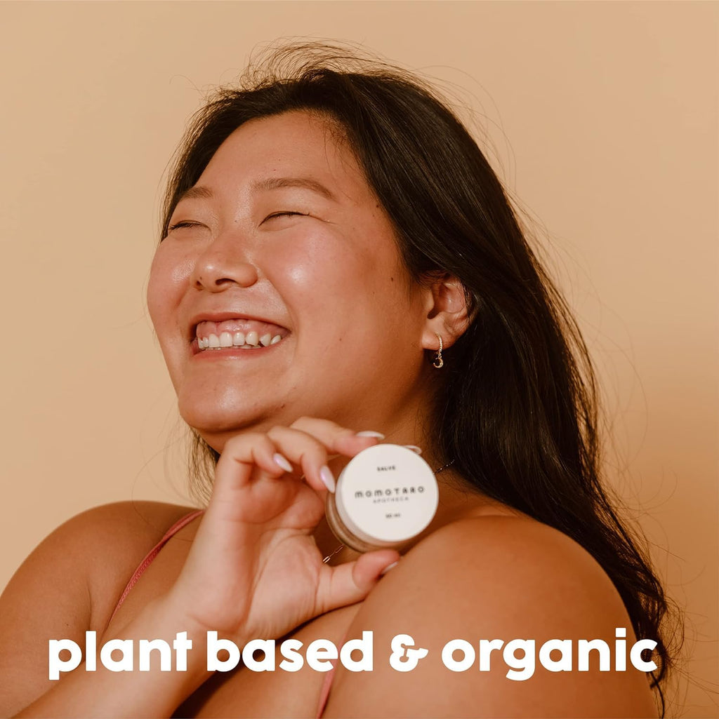 Woman holding a jar with 'plant based & organic' text on a beige background